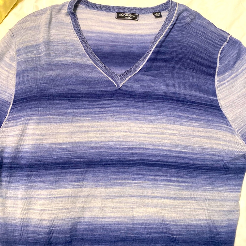 100% merino wool light blue sweater.